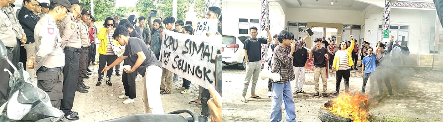 Mahasiswa sedang menaburkan bunga di pintu masuk kantor KPU Simalungun sambil membakar ban bekas sebagai aksi protes terhadap prilaku komisioner KPU Simalungun yang diduga keras telah melanggar etik, Rabu (22/5).(Waspada/ist).