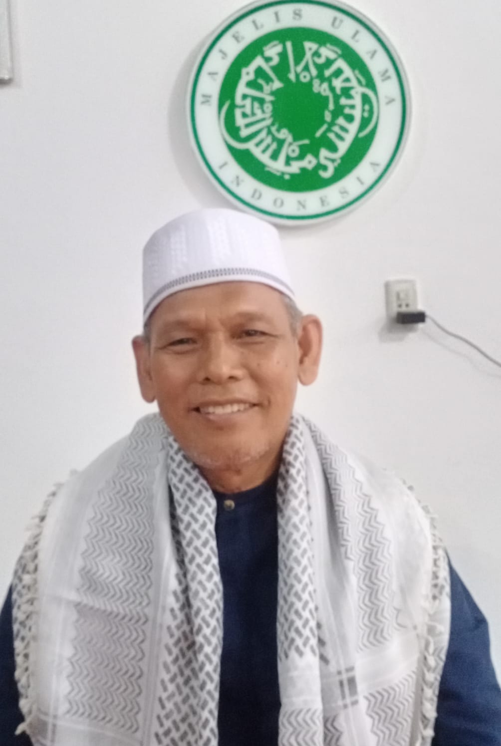 Ketua Umum MUI Sergai Drs H Hasful Huznain SH (Waspada/Edi Saputra)