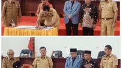 Ketua DPRD Nias Selatan, Elisati Halawa bersama Bupati Nias Selatan, Sokhiatulo Laia  saat menandatangani persetujuan Ranperda RPMJD 2025-2045 dan Ranperda Bangunan Gedung, Selasa (11/3). Waspada/Budi Gowasa