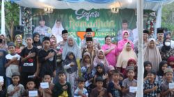 Kapolres Simalungun AKBP Choky S Meliala didampingi Ketua Bhayangkari Ny. Rina Choky Meliala, memberikan tali asih kepada anak yatim dan dhuafa di Ramadhan Fair Serbelawan, Sabtu (15/3).(Waspada/ist).